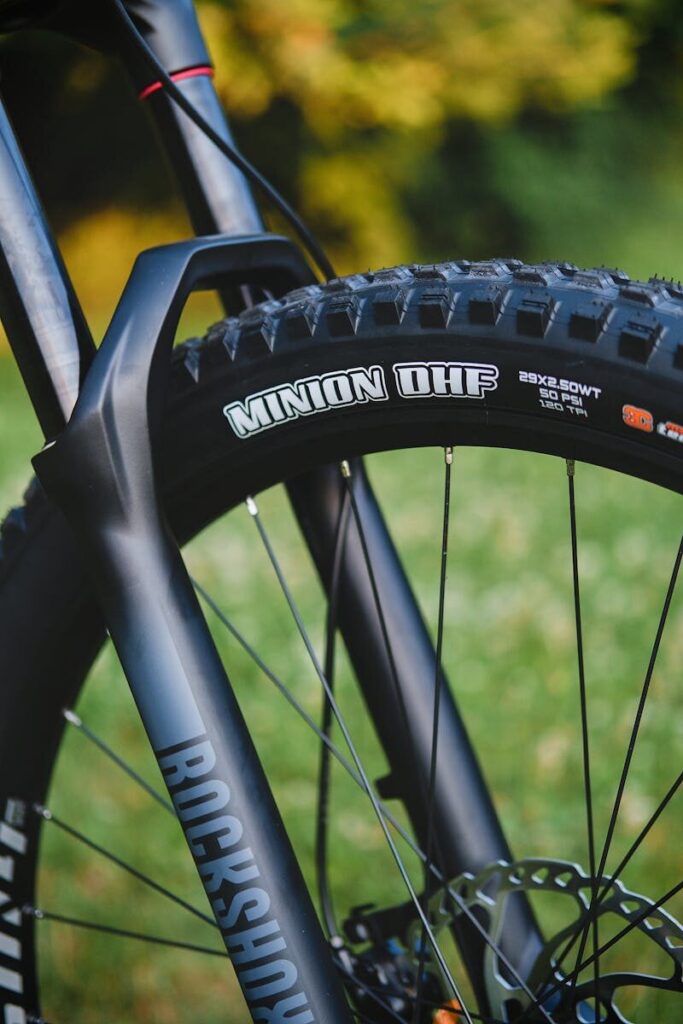 a close up of a bike tire on a sidewalk